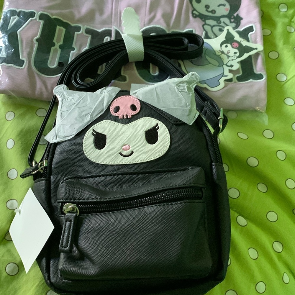 Super cute Kuromi crossbody bag.  2 zipper compartments. Got it from Sanrio.com.